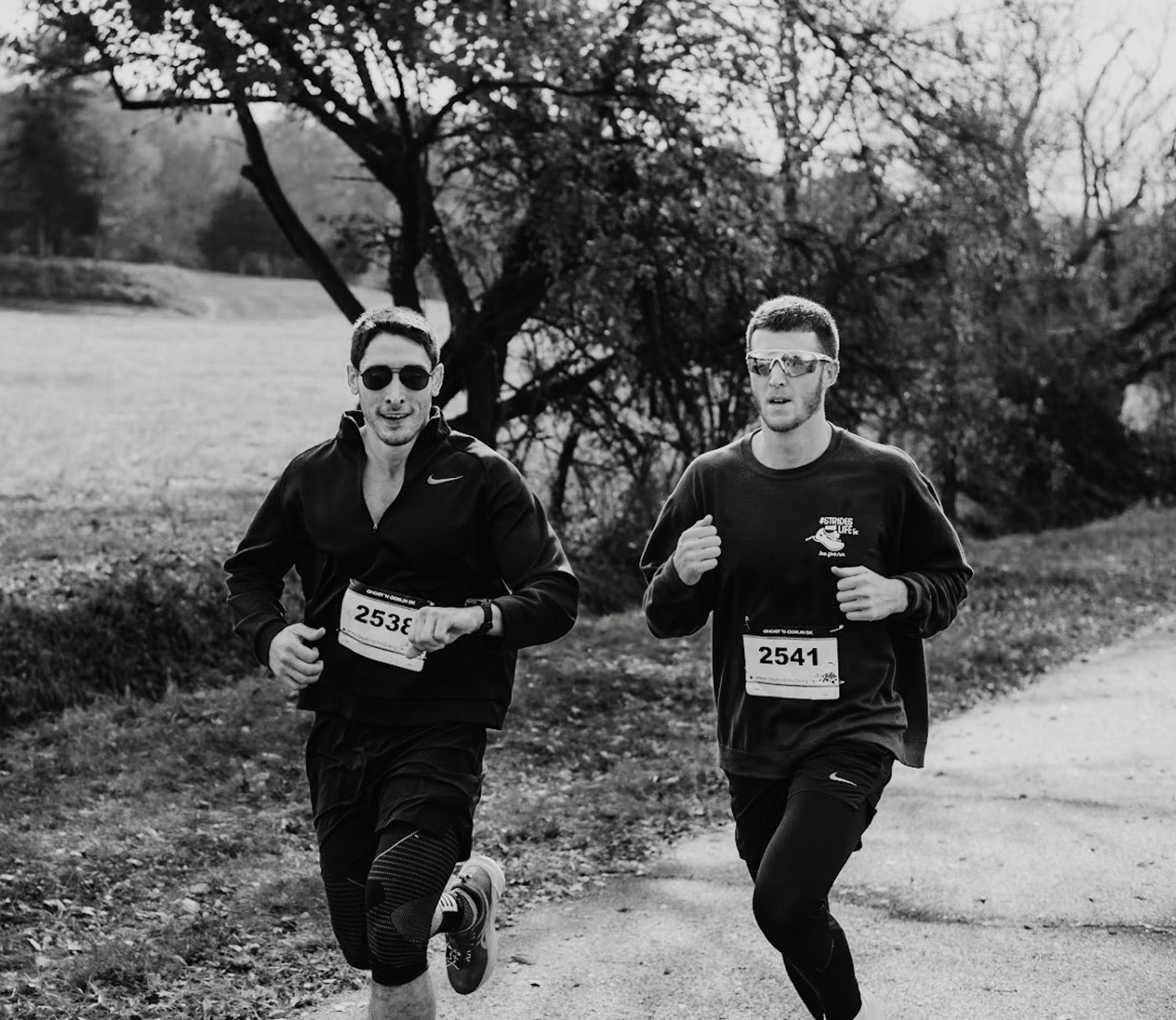 Two runners on a trail running together